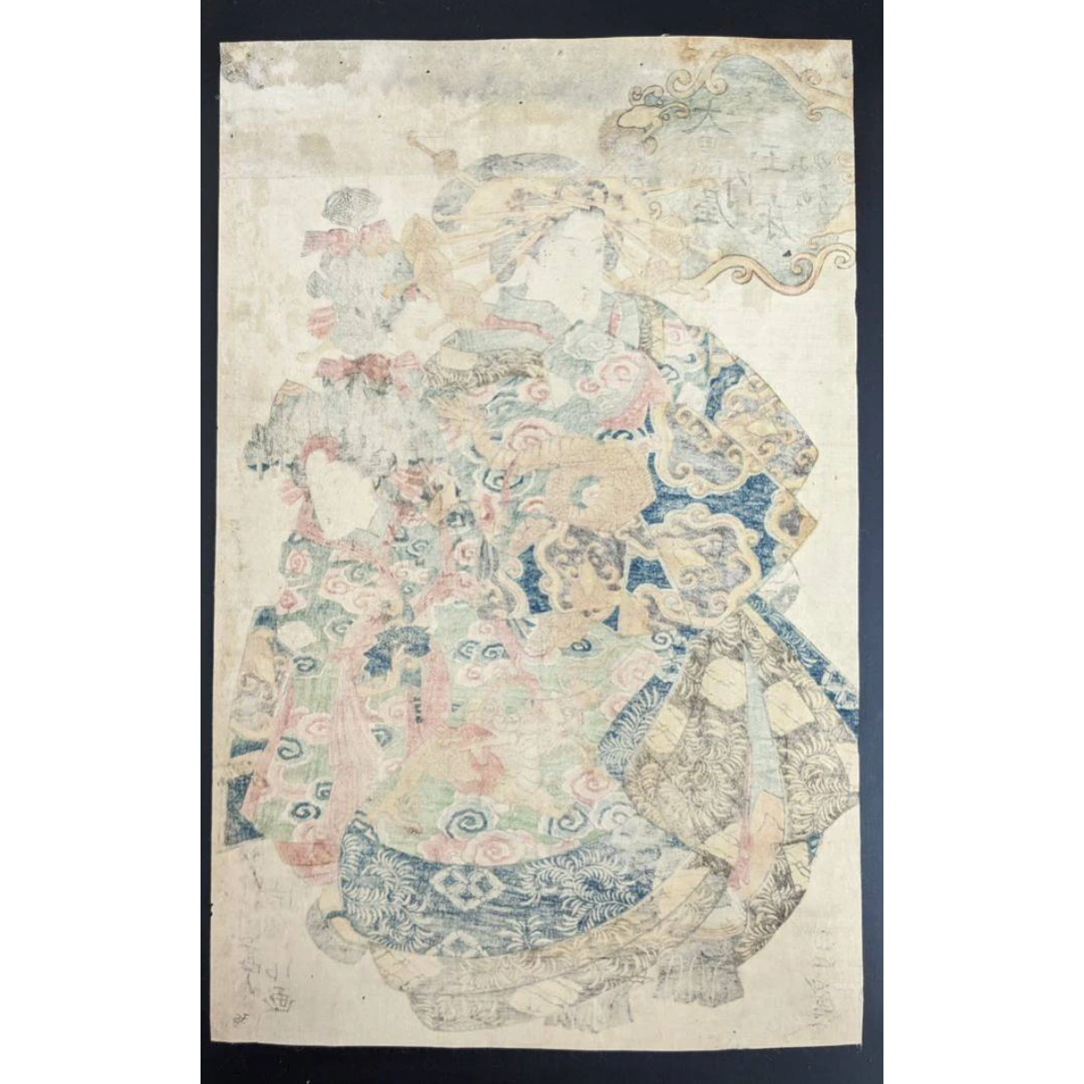 Back view showing the detailed hairstyles and kimono patterns of three Edo-period women by Utagawa Tominobu.