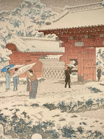 Close-up of Japanese artwork showing snow-covered tree branches and red gate detail from Kasamatsu Shiro’s winter scene at Hongo.