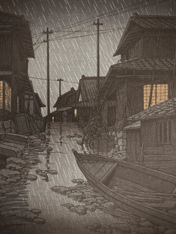 Close-up of rain falling on a glowing window and wet wooden wall in a peaceful, rainy Japanese village scene by Kawase Hasui.