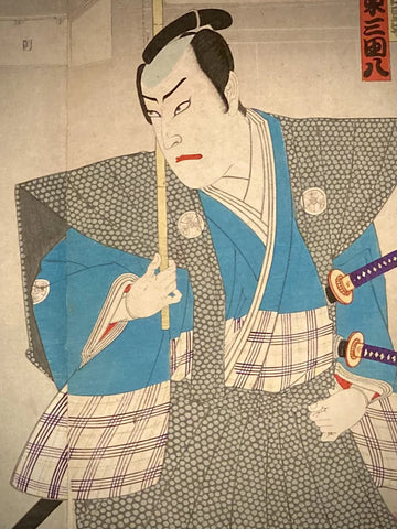 Close-up of Japanese art print showing detailed kimono fabric, facial expressions, and sword grips in Kunichika’s dramatic samurai scene from a Kabuki performance.