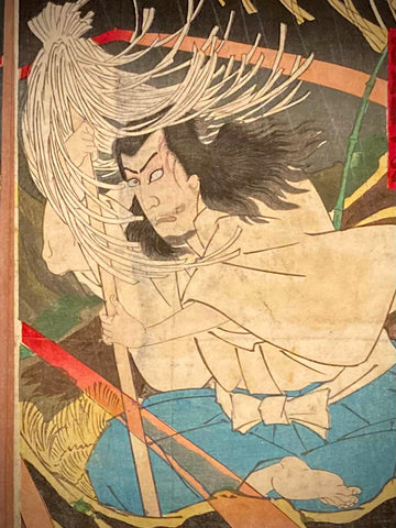 Close-up of a Japanese print showing the fierce white-haired yokai with dynamic brushwork and red lightning streaks, highlighting dramatic folklore themes.