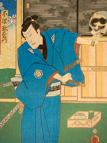 Close-up of a samurai’s intense gaze into a mirror reflecting a cat’s face. Rich blue kimono and sword details highlight Kunisada’s expressive style.