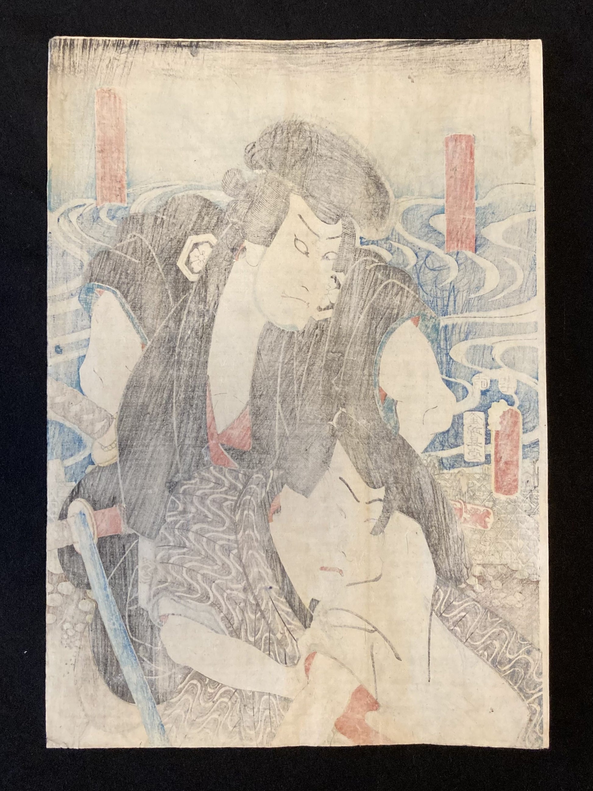 “Reverse side of the Kunisada woodblock print showing aged paper, possible publisher marks, and light foxing from time and handling.