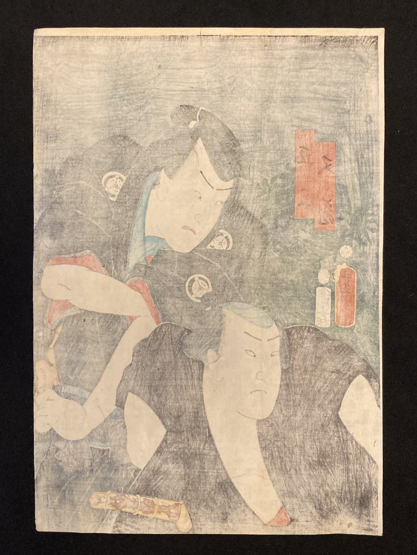 Reverse side of a traditional Japanese woodblock print by Kunisada, showing aged paper, possible seals, and signs of historic wear.