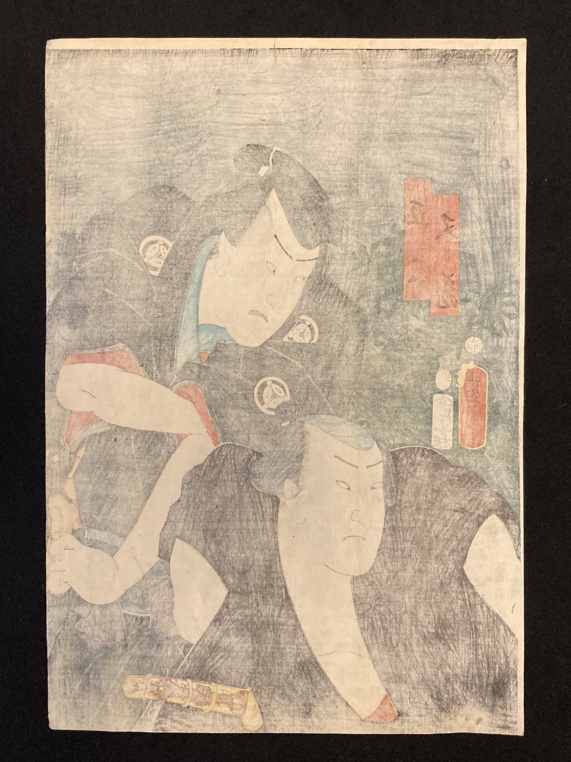 Reverse side of a traditional Japanese woodblock print by Kunisada, showing aged paper, possible seals, and signs of historic wear.