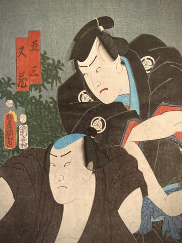 Detailed close-up of a Japanese woodblock print by Utagawa Kunisada, showing expressive facial features and intricate kimono patterns.